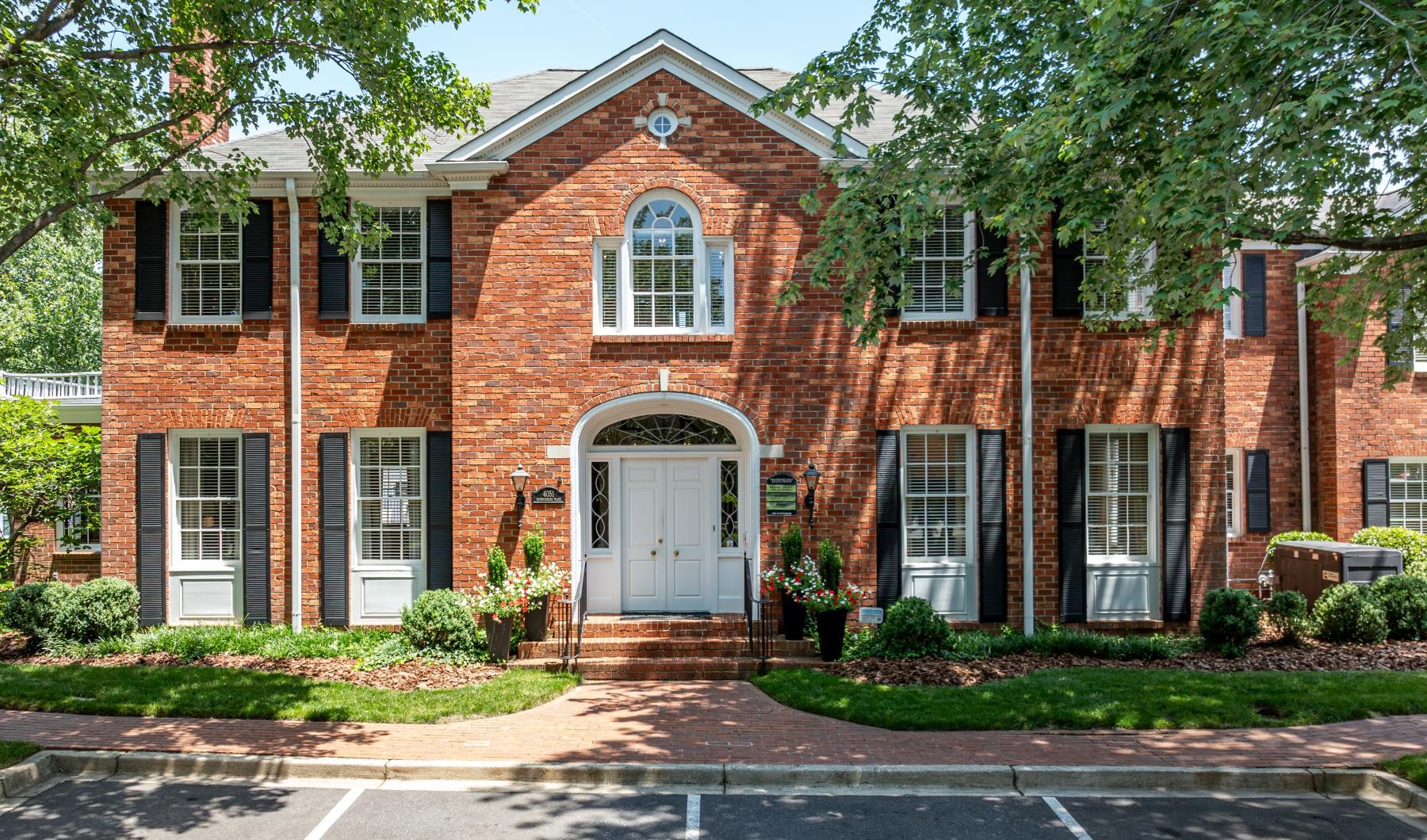 a brick building with a white door